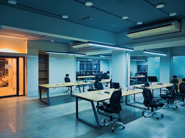 Diverse Olsamtech team collaborating in a modern office